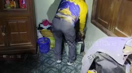 Rescue team catches 12ft king cobra hiding in family's home