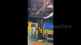 Boy, 6, braves wind and rain to operate lift for acrobat parents