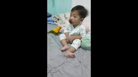 Toddler and pet parrot are best of friends