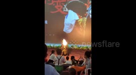 Fire breather blasted by cinema's automatic sprinklers mid-stunt in China
