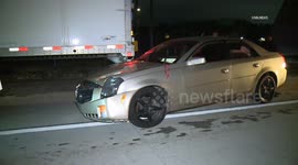 US, Los Angeles: Pomona Car Rear Ends Semi Trailer on 10 Freeway
