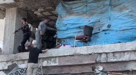 Israeli strike kills 6 Palestinians sheltering near damaged bank tower in Gaza