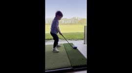 Boy Hits His First Golf Ball