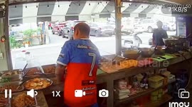 Shopkeepers falls over when he tries to sit in nonexistent chair