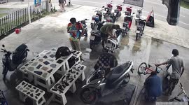 Bicycle tire explodes while man inflates it at shop