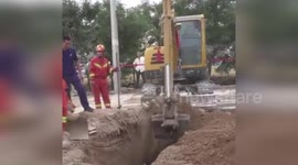 Firemen lower skinny boy, 13, into narrow hole to save trapped girl