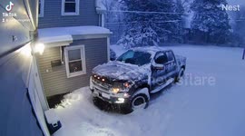 Pickup Slides Out of Icy Driveway