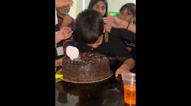 Child startled and cries after cake prank on birthday in Lima, Peru