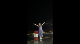 Woman gets soaked by sudden wave while posing by the sea in Guangdong, China
