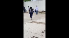 Woman trips while chasing man in Rosario, Argentina