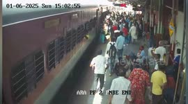 Station guards save female police when she slips from moving train carriage