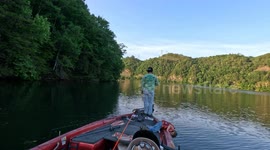 Dad Calmly Rescues Son Who Falls Into Lake Water During Fishing Trip