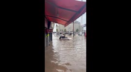 Turkey: Man Rides Mattress Through Flooded Streets in Trabzon, Drawing Laughter