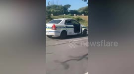 Police officer seen driving doorless patrol vehicle faces disciplinary action