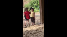 Child patiently waits for swing in Brisbane, Australia