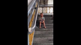 Toddler seen smoking on set of steps sparks concern in Bangkok