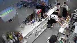 Hot water dispensers topple from fast food restaurant counter