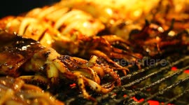 Street food : Fresh grilled squid is a favorite seafood of visitors