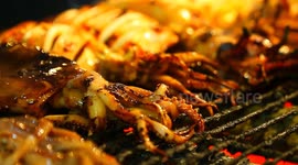Street food : Fresh grilled squid is a favorite seafood of visitors