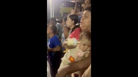 Sports Game Distracts From Bottle Feeding Baby