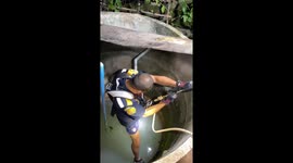 Rescue team rappels into 20ft well to save trapped kitten