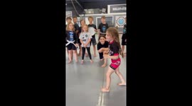 Kid performs juji gatame during mma training in Port Orange, Florida, USA