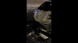 Charred vehicle near PSG stadium after Champions League chaos.