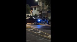 Group of Men Lift a Car Back Over Median