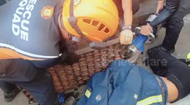Firemen rescue boy, 15, with arm stuck in manhole cover