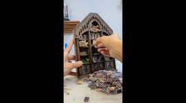 Creative montage captures the process of building a beautiful Gothic bookshelf with tiny books