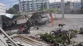 Customer narrowly escapes being crushed by car hurtling into repair shop