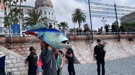 Ocean Rebellion performers dress up as French President Macron to protest bottom trawling at UN Ocean Conference in Nice, France