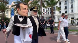 Photos added Ocean Rebellion performers dress up as French President Macron to protest bottom trawling at UN Ocean Conference in Nice, France