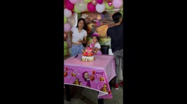 Toddler gets startled by sparkling candle during birthday in Barquisimeto, Venezuela