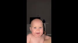 Baby smiles and gets excited after mom laughs in Krasnodar, Russia
