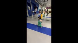 Little girl enjoys indoor zipline ride in Hwaseong-si, South Korea