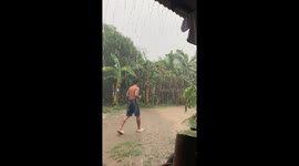 Resident playing in the rain stunned by lightning strike a few metres away