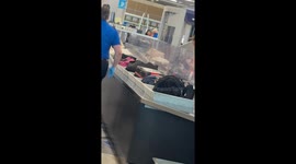 TSA chorus performs amid long baggage lines in Las Vegas, Nevada, USA