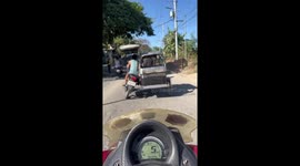 Leaning tricycle drives funny in Taytay, Rizal, Philippines