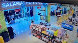 Shop assistant slips over on shiny tiles while running to customer