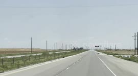 Large strong dust devil close to the highway in west Texas