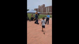 Little kid outswags police mascot in epic dance battle