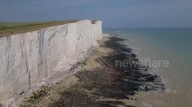Several cliff falls below coastal footpath at the Seven Sisters National Park means the track is precariously close to under cut cliffs 120 metres high, Beachy Head, East Sussex, UK