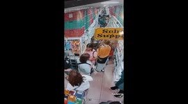 Women seen on CCTV appearing to steal from customer at supermarket