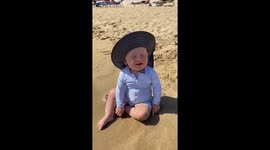 Happy Baby Playing on the Beach for the First Time