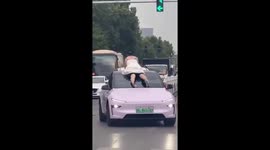 Crazed pedestrian smacks on Tesla windshield