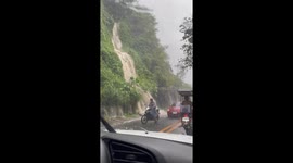 Water surges down mountainside amid heavy rain in the Philippines