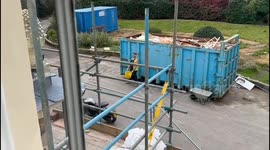 Construction worker ends up being covered in garbage while trying to clean up