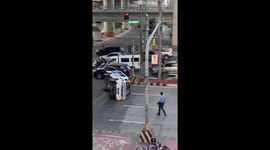 Bystanders and police assist after ambulance tips over in Parañaque, Philippines