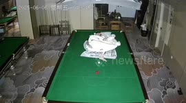 Man pockets balls while half-asleep in Shandong, China